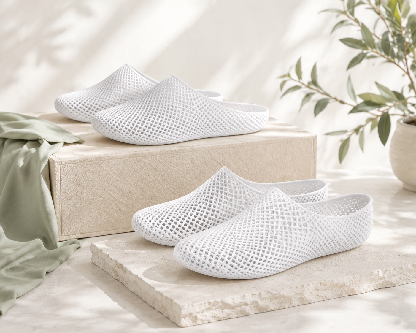 NUWA complete reset set with sneaker and slipper pairs arranged in soft natural light